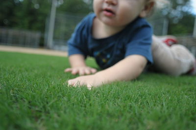 Baby on grassy field