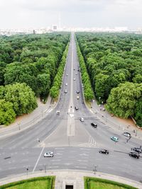 High angle view of road amidst trees against sky