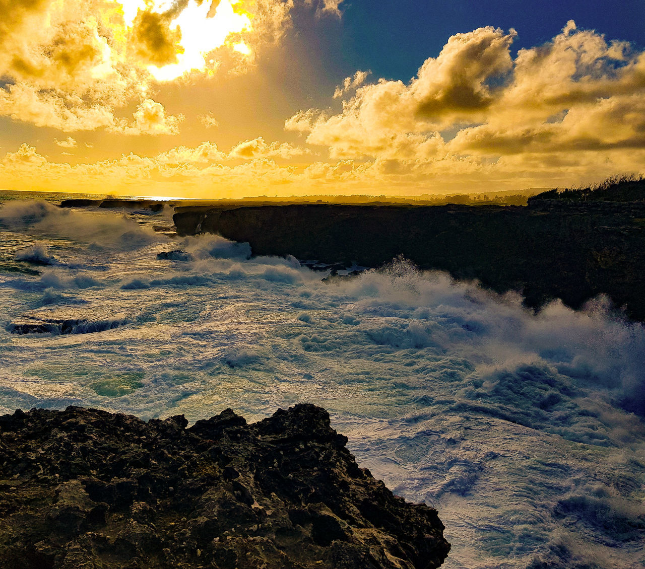 SCENIC VIEW OF SEA AGAINST ORANGE SKY