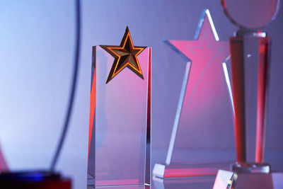 Close up of crystal trophy against gray background