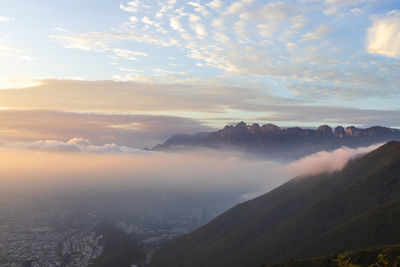 Scenic view of mountains against sky during sunset