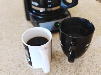 High angle view of coffee cups on table