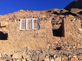 Low angle view of old building against clear sky