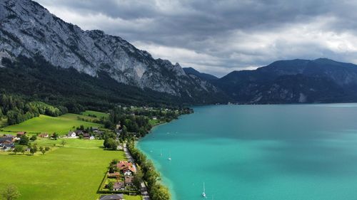 Scenic view of lake and mountains against sky