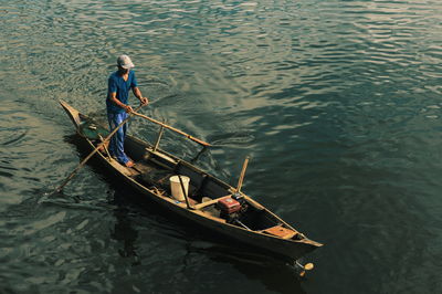 High angle view of man on boat in lake