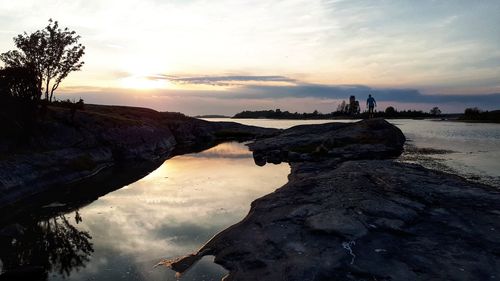 Scenic view of beach against sky during sunset