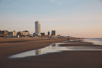 View of beach with city in background