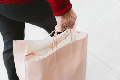 Midsection of woman holding gift