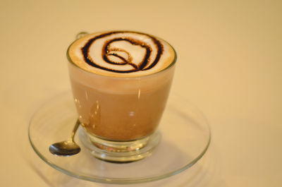 Close-up of cappuccino served on table