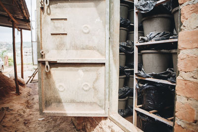 Clay pots on shelves in storage room