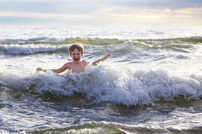 Portrait of boy in sea