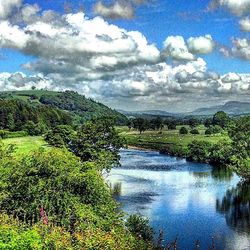 Scenic view of landscape against cloudy sky