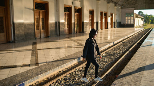 Man walking on railroad station platform