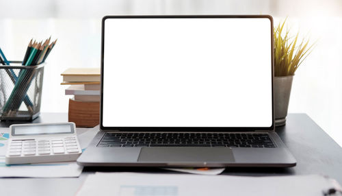 Close-up of laptop on table