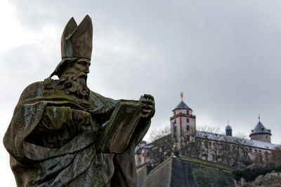 Low angle view of statue against sky