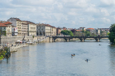 The murazzi on the river po in turin with the buildings reflected in the water