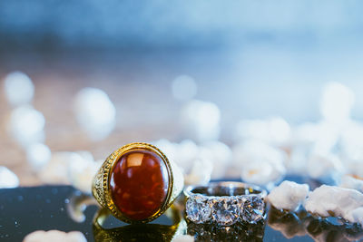 Close-up of wedding rings on table