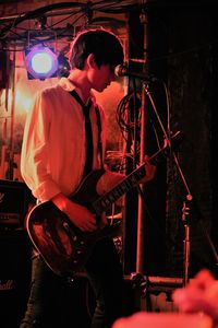 Man playing guitar at night