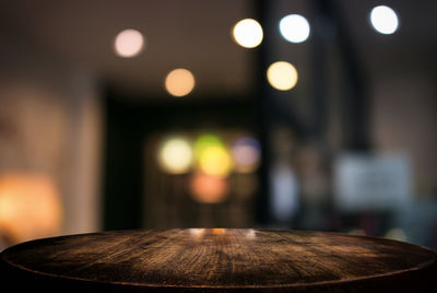 Close-up of illuminated lighting equipment on table