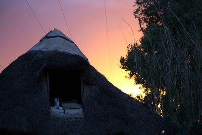 Silhouette of building at sunset