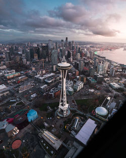 High angle view of modern buildings in city against sky