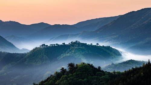 Scenic view of mountains against sky during sunset