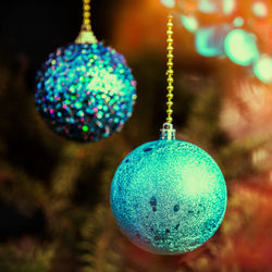Close-up of christmas decorations hanging on tree