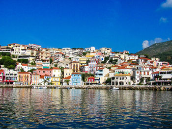 Buildings in town against blue sky