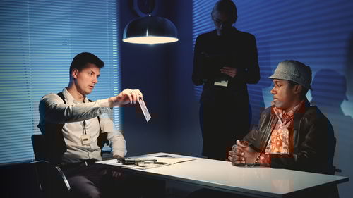 Young man and woman standing on table