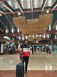 Full length of man standing at airport