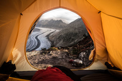 View of mountains seen from orange tent