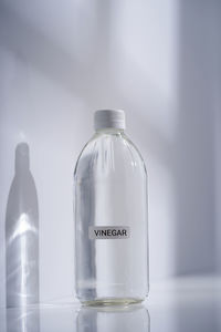Glass bottle on table