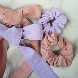 High angle view of woman with pink flowers on hardwood floor