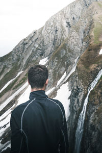 Rear view of man looking at mountain