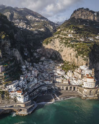 Aerial view of townscape by sea