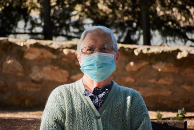 Close-up portrait of an older woman wearing a mask person