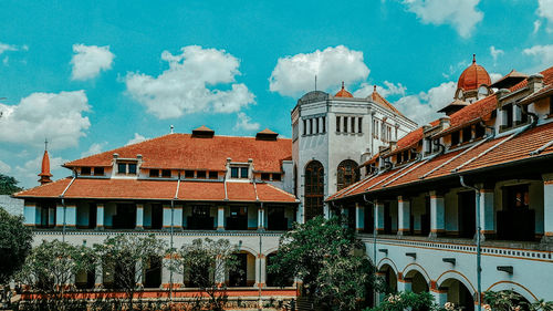 Low angle view of european buildings against the blue sky. 