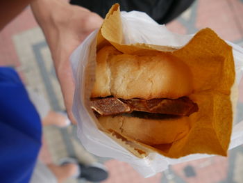 Close-up of man holding sandwich