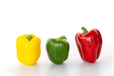 Close-up of bell peppers against white background