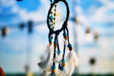 Close-up of dreamcatcher hanging outdoors