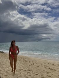 Full length of man on beach against sky