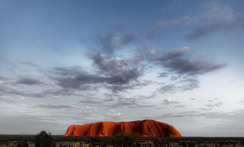 Tent on landscape against sky