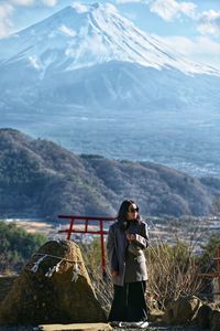 Rear view of man standing on mountain