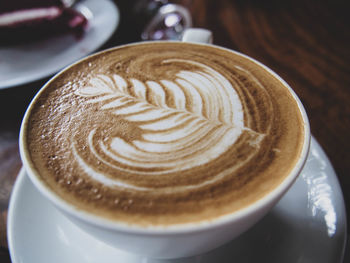 Close-up of cappuccino on table