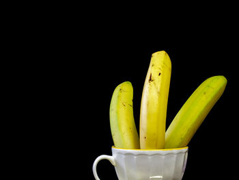 Close-up of yellow juice against black background