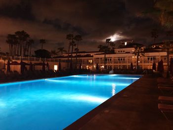 View of swimming pool at night