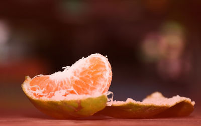 Close-up of orange slice on table