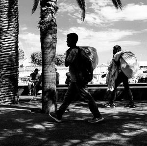 People playing on street in city