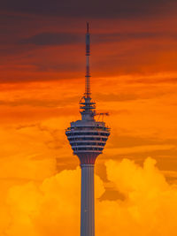 Low angle view of tower against sky during sunset