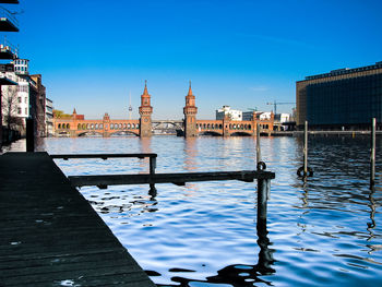 Buildings against clear sky with waterfront